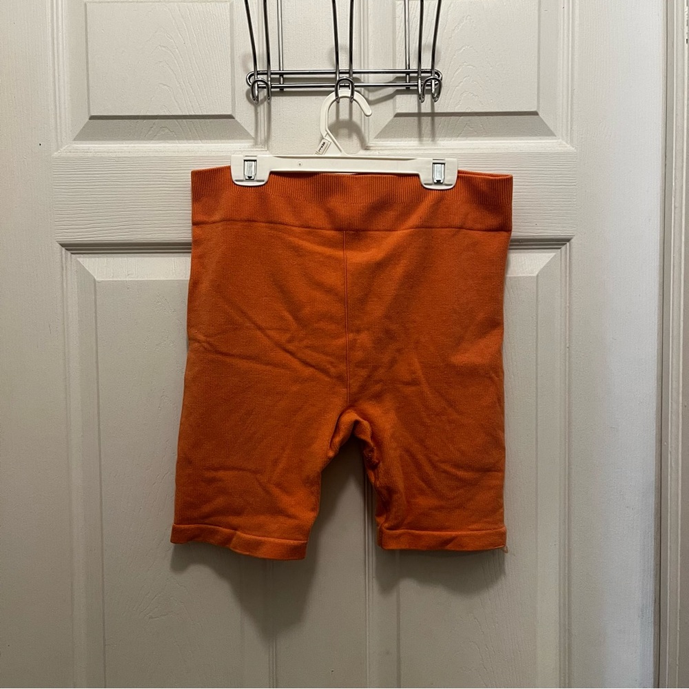 orange biker shorts